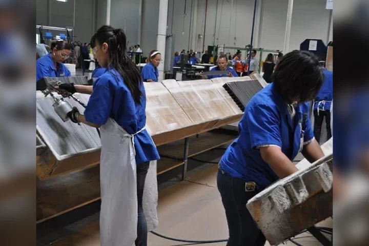 Female workers in a electronics manufacturing facility.